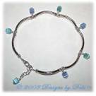 Dangling blue and aqua cat's eye cubes and silver curved tube bead handmade anklet.