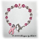 Designs by Debi handmade sterling silver and rose pink Swarovski crystal Awareness Bracelet with a pink ribbon lampwork bead, heart ribbon toggle and a pink ribbon charm.