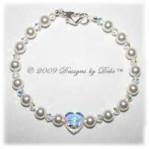 White pearl, Swarovski crystal AB heart and bicones handmade bracelet with a sterling silver heart lobster clasp for wedding bride.