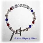 Designs by Debi handmade sterling silver and Swarovski crystal Graduation Bracelet with name in sterling silver alphabet cubes, red, clear and cobalt crystals, a heart toggle and a 2009 graduation year charm