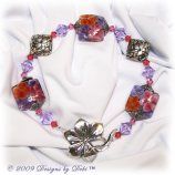 Hawaiian Lei one-of-a-kind handmade artisan lampwork and Bali silver toggle bracelet with pink, violet and padparadscha Swarovski crystals.