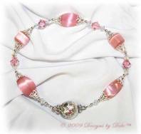 Designs by Debi Handmade Jewelry Pink Cat's Eye Twist and Cube Beads with Swarovski Crystal AB and Light Rose Bicones Bracelet with a Silver and Crystal Magnetic Clasp