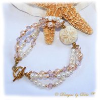 Designs by Debi Handmade Jewelry Sand Dollar Handmade Lampwork Bead, Swarovski Crystal Silk Bicones and Peach Pearls and White Freshwater Pearls Multi-Strand Bracelet with Gold Plated Beads and Round Toggle Clasp ~ OOAK