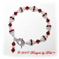 Designs by Debi Handmade Jewelry Swarovski Crystal Siam Red Bicones and Silver Filigree Bracelet with a Silver Round Toggle Clasp