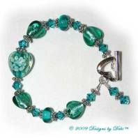 Designs by Debi Handmade Jewelry Teal Hearts and Swarovski Crystal Blue Zircon Bicones Bracelet with a Silver Heart Toggle Clasp