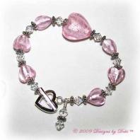 Designs by Debi Handmade Jewelry Light Pink Foiled Glass Hearts and Swarovski Crystal Bicones Bracelet with a Silver Heart Toggle Clasp