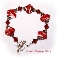 Designs by Debi Handmade Jewelry Red and White Diamond Artisan Handmade Lampwork, Swarovski Crystal Siam Red Bicones and Sterling Silver Bracelet with a Sterling Silver Scrolled Diamond Toggle Clasp ~ OOAK