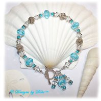 Designs by Debi Handmade Jewelry Aqua Dreams Aqua Swirled Handmade Lampwork, Bali Silver and Swarovski Crystal Bracelet with Sterling Silver Twisted Rope Toggle Clasp ~ OOAK
