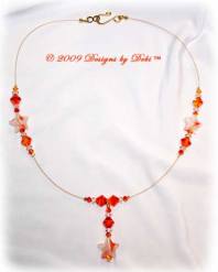 Designs by Debi Handmade Jewelry White & Orange Stars and Swarovski Crystal Fire Opal Bicones Gold Wire Floating Necklace with a Gold Hook Clasp