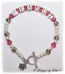 Designs by Debi Handmade Jewelry Pet Name Keepsake Bracelet in the Karen Style Twist and Stardust bead combination with Rose (October) crystals, a bright twisted rope toggle clasp and Paw charm. Mother's Bracelet