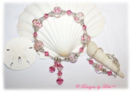Designs by Debi Handmade Jewelry Aloha Collection Pink Bracelet and Anklet Set. Features large pink aloha floral rondelles, swarovski crystal rose bicones, silver filigree bead caps, dangles, a magnetic clasp and matching anklet.