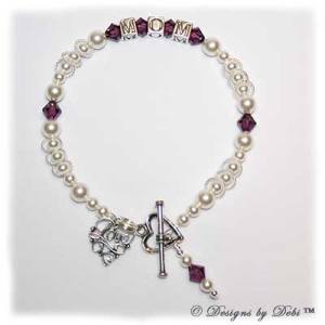 Designs by Debi Handmade Jewelry This is the Isabella Style Bracelet in the Pearls bead combination with Amethyst (February) crystals, a Heart toggle clasp, Love Filigree charm and Amethyst birthstone dangle.