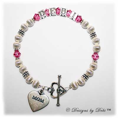 Designs by Debi Handmade Jewelry Kiara Style Bracelet in the Corrugated bead combination with Rose (October) crystals, a heart toggle clasp and Mom heart charm.