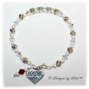 Designs byDebi Handmade Jewelry Melania Style Bracelet in the Twist and Stardust bead combination with Crystal AB crystals, a small swivel lobster clasp, Nana heart charm and Siam (July) birthstone dangle.