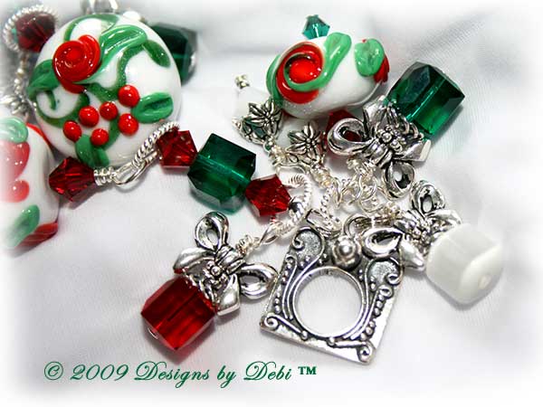 The Perfect Christmas Present Handmade Bracelet made with artisan handmade lampwork beads, Bali silver, Swarovski crystal, and cat's eye with a Bali toggle style clasp. Close-up of clasp.