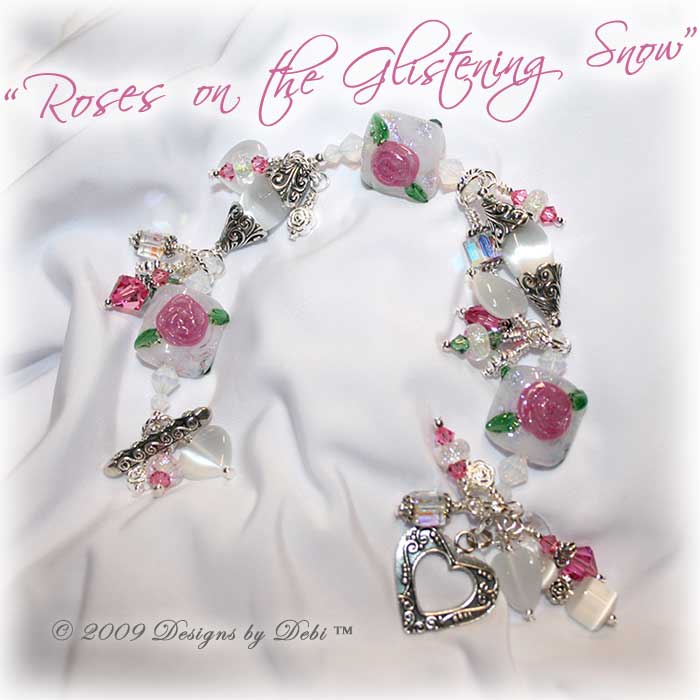 Roses on the Glistening Snow One-of-a-Kind Handmade Bracelet made with artisan handmade lampwork beads, Bali silver, Swarovski crystal, and cat's eye with a toggle style clasp.