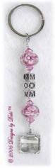 Handmade key chain with Mom in alphabet letter cubes, pink aloha glass beads, rose pink Swarovski crystals and a picture frame charm.