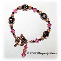 Designs by Debi Handmade Jewelry Copper Stardust, Black Glass with Pink Roses and Swarovski Crystal Jet and Rose Bicones Bracelet with a Copper Rose Toggle Clasp