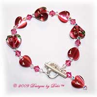 Designs by Debi Handmade Jewelry Dark Pink Lampwork, Cat's Eye and Swarovski Crystal AB and Rose Bicones Bracelet with Sterling Silver Heart Toggle Clasp