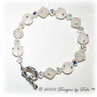 Designs by Debi Handmade Jewelry White Resin Round and Bicone Beads and Swarovski Crystal AB Bicones Bracelet with a Silver and Crystal AB Round Toggle Clasp