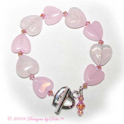 Pink Glass Hearts and Swarovski Crystal Light Rose AB2x Bicones Bracelet with a Silver Heart Toggle Clasp