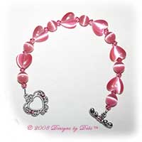 Designs by Debi Handmade Jewelry Pink Cat's Eye Hearts and Round and Swarovski Crystal Rose Bicones Bracelet with a Silver Filigree Heart and Crystal Toggle Clasp