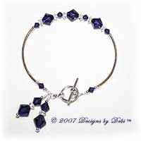 Designs by Debi Handmade Jewelry Swarovski Crystal Purple Velvet Bicones and Crystal Spacers Curved Tube Bracelet with a Silver Round Toggle Clasp