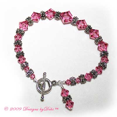 Designs by Debi Handmade Jewelry Swarovski Rose Bicones and Silver Floral Rondelles Round Toggle Bracelet