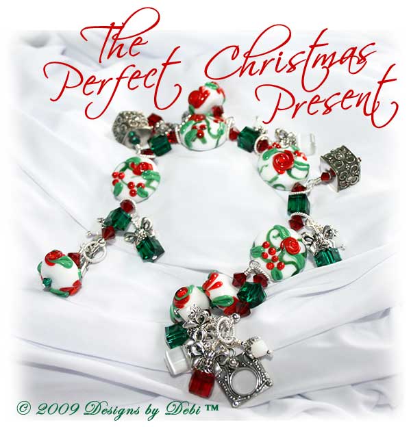 The Perfect Christmas Present One-of-a-Kind Handmade Bracelet made with red, green and white artisan handmade lampwork beads, Bali silver, Swarovski crystals in siam, emerald and white alabaster, and cat's eye with a Bali toggle style clasp.