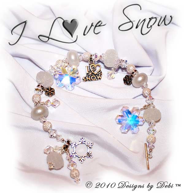 I Love Snow One-of-a-Kind Handmade Bracelet and Earrings Set made with sugar and pixie white artisan handmade lampwork beads, sterling silver snowflakes, Swarovski crystals snowflakes and simplicity and bicones in crystal AB with a sterling silver snowflake toggle style clasp.