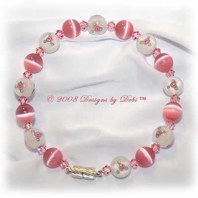 Designs by Debi Handmade Jewelry Pink Cat's Eye, Swarovski Crystal Light Rose Pink Bicones and White Glass Beads with Rosebuds Bangle Style Memory Wire Bracelet with Silver Magnetic Clasp