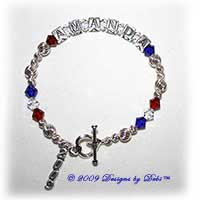 Designs by Debi handmade sterling silver and Swarovski crystal Graduation Bracelet with name in sterling silver alphabet cubes, red, clear and cobalt crystals, a heart toggle and a 2009 graduation year charm
