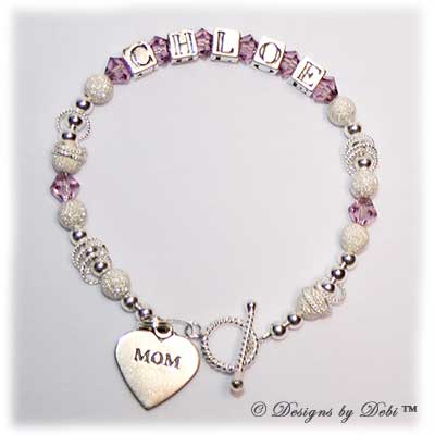 Designs by Debi Handmade Jewelry Isabella Style Bracelet in the Stardust and Seamless Round bead combination with Light Amethyst (June) crystals, a Bright Twisted Rope toggle clasp and Mom heart charm.
