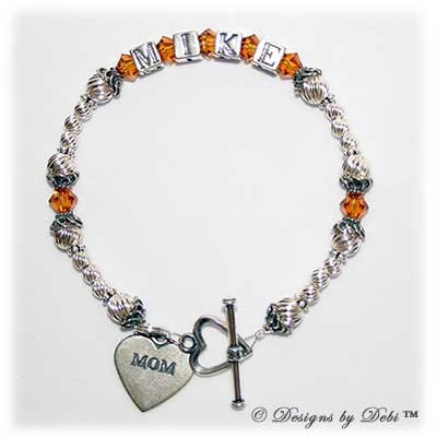 Designs byDebi Handmade Jewelry Marisol Style Bracelet in the Twist bead combination with Topaz (November) crystals, a heart toggle clasp and Mom heart charm.
