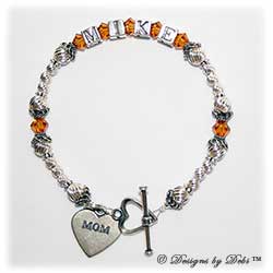 Designs by Debi Handmade Jewelry Keepsake Bracelet in the Marisol Style Twist bead combination with Topaz November) crystals, a heart toggle clasp and Mom heart charm. Mother's Bracelet