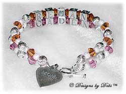 Designs by Debi Handmade Jewelry 2 strand Keepsake Bracelet in the Melania Style Twist and Stardust bead combination with Topaz (November) and Rose (October) crystals, a Heart toggle clasp and Mom heart charm. Mother's Bracelet