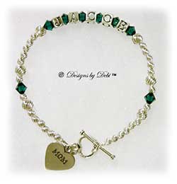 Designs by Debi Handmade Jewelry Personalized Keepsake Bracelet in the Karen Style Twist bead combination with Emerald (May) crystals, a heart toggle clasp and Mom heart charm. Mother's Bracelet