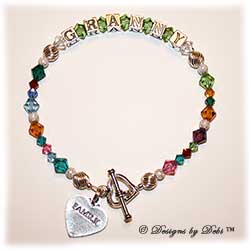 Designs by Debi Handmade Jewelry Generations Keepsake Bracelet in the Melania Style Twist and Stardust bead combination with every family member's birthstone, a heart toggle and Family heart charm.