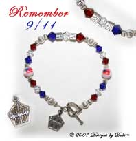 Designs by Debi Handmade Jewelry Remember 9/11 Sterling Silver Round and Flag Cube Beads and Swarovski Crystal Red, Crystal & Blue Bicones Bracelet with a Heart Toggle Clasp and Twin Towers Charm
