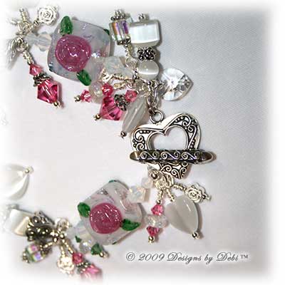 Roses on the Glistening Snow Handmade Bracelet made with artisan handmade lampwork beads, Bali silver, Swarovski crystal, and cat's eye with a toggle style clasp.