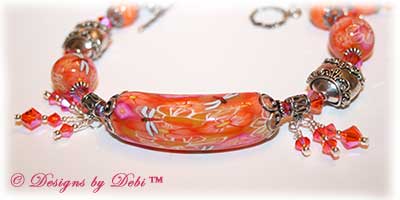 Can't Wait for Spring! Designs by Debi Jewelry for Charity Bracelet March 2011 A fun, one of a kind handmade bracelet of orange, pink and white polymer clay beads with flowers and dragonflies, Bali silver beads, Swarovski crystals and sterling silver. OOAK