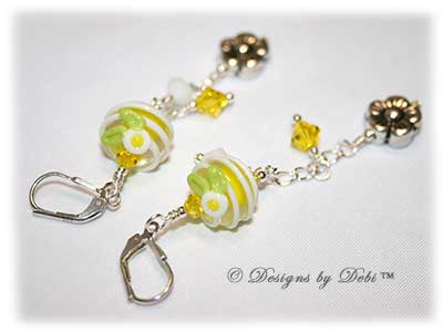 Designs by Debi Handmade Jewelry for Charity Bracelet and Earrings Set Hope for a Bright Future. The one of a kind ooak bracelet features handmade artisan lampwork glass beads, sterling silver flower beads, Swarovski citrine and white alabaster bicones, a sterling silver hook clasp and extender chain with charms. The one of a kind earrings are leverback style with matching beads, crystals and chain.