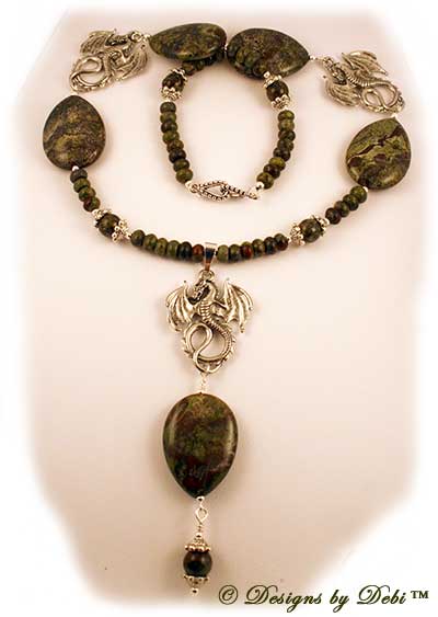 Designs by Debi Handmade OOAK Jewelry for Charity Necklace and Earrings Set for August 2011 called Dylan's Dragon Warriors. Made with multiple pewter dragons, green and red dragon blood jasper in teardrop, round and rondelle shapes and pewter dragon feet bead caps.