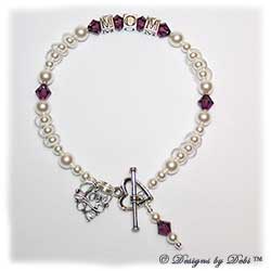 Designs by Debi Handmade Jewelry Keepsake Bracelet in the Isabella Style Pearls bead combination with Amethyst (February) crystals, a Heart toggle clasp, Love Filigree charm and Amethyst birthstone dangle.  Mother's Bracelet Wedding Bracelet