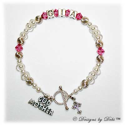 Designs byDebi Handmade Jewelry Isabella Style Bracelet in the Twist and Pearls bead combination with Rose (October) crystals, a Bright Twisted Rope toggle clasp, Godmother charm and additional Cross charm.