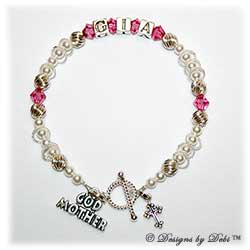 Designs by Debi Handmade Jewelry Keepsake Bracelet in the Isabella Style Twist and Pearls bead combination with Rose (October) crystals, a Bright Twisted Rope toggle clasp, Godmother charm and additional Cross charm. Godmother's Bracelet