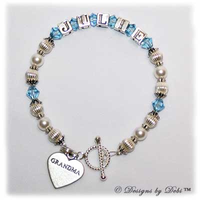 Designs by Debi Handmade Jewelry Jasmine Style Bracelet in the Corrugated and Pearls bead combination with Aquamarine (March) crystals, a bright twisted rope toggle clasp and Grandma heart charm.