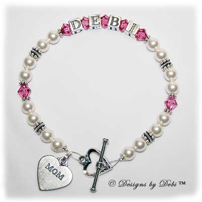 Designs by Debi Handmade Jewelry Kiara Style Bracelet in the Pearls bead combination with Rose (October) crystals, a heart toggle clasp and Mom heart charm.