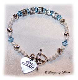 Designs by Debi Handmade Jewelry Personalized Keepsake Bracelet in the Karen Style Twist and Stardust bead combination with Aquamarine (March) crystals, a heart toggle and Best Friends heart charm. Best Friends Bracelet