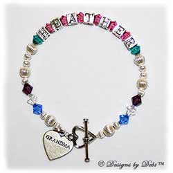 Designs by Debi Handmade Jewelry Family Keepsake Bracelet in the Karen Style Corrugated bead combination with every family member's birthstone, a heart toggle clasp and Grandma heart charm.Grandmother's or Nana's Bracelet